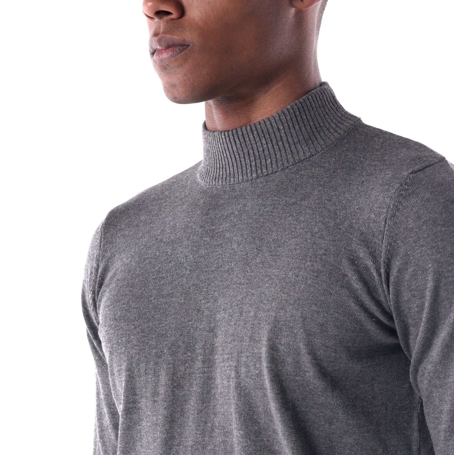 Gray turtleneck sweater worn by a person on a white background