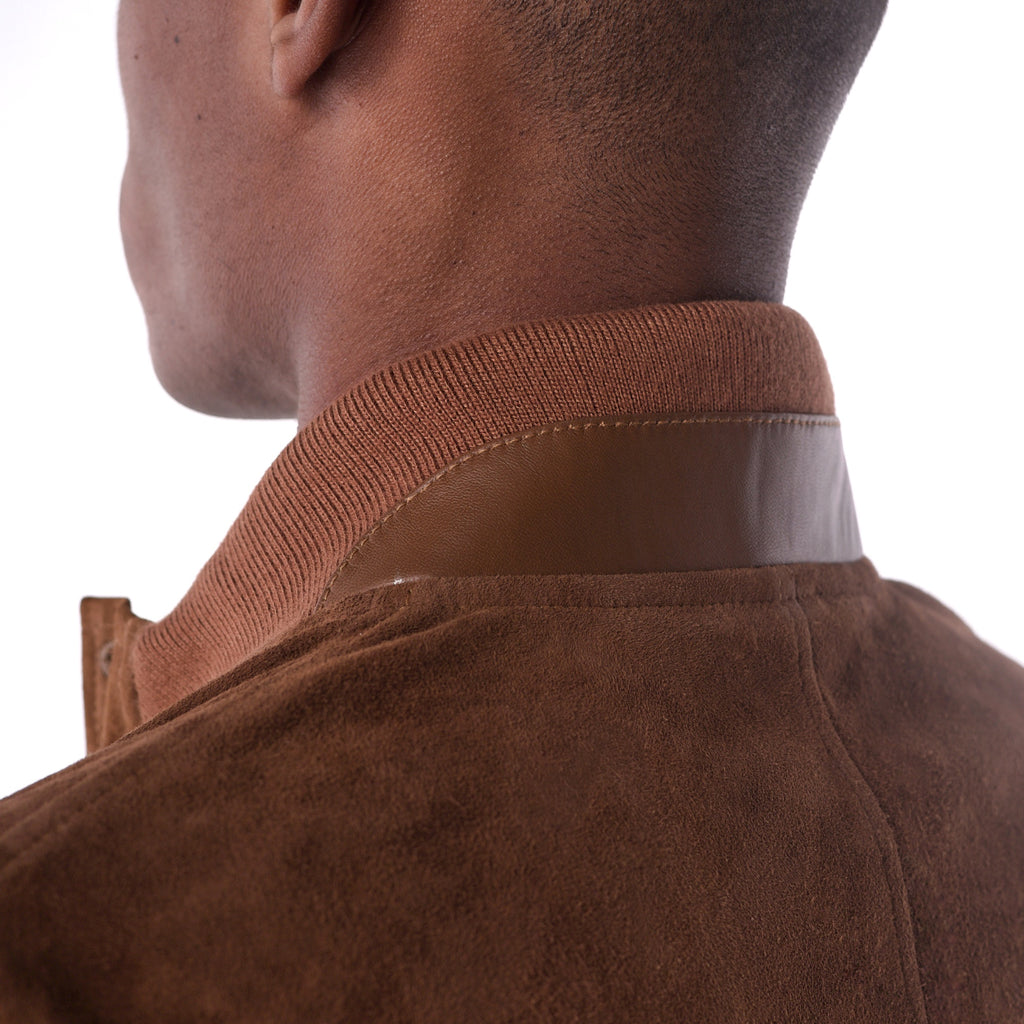 Close-up of a brown jacket collar on a white background