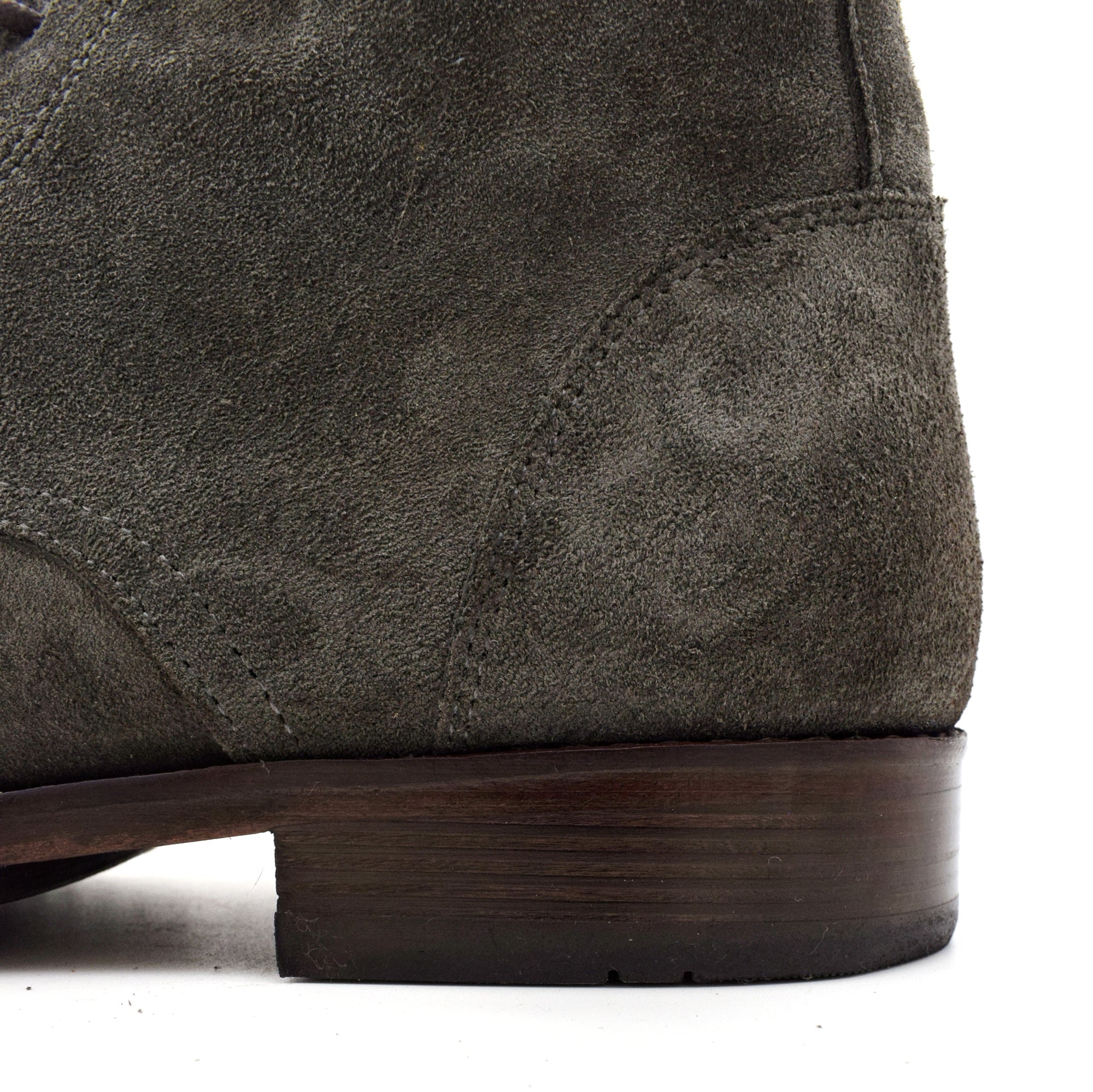 Close-up of a brown suede shoe sole on a white background
