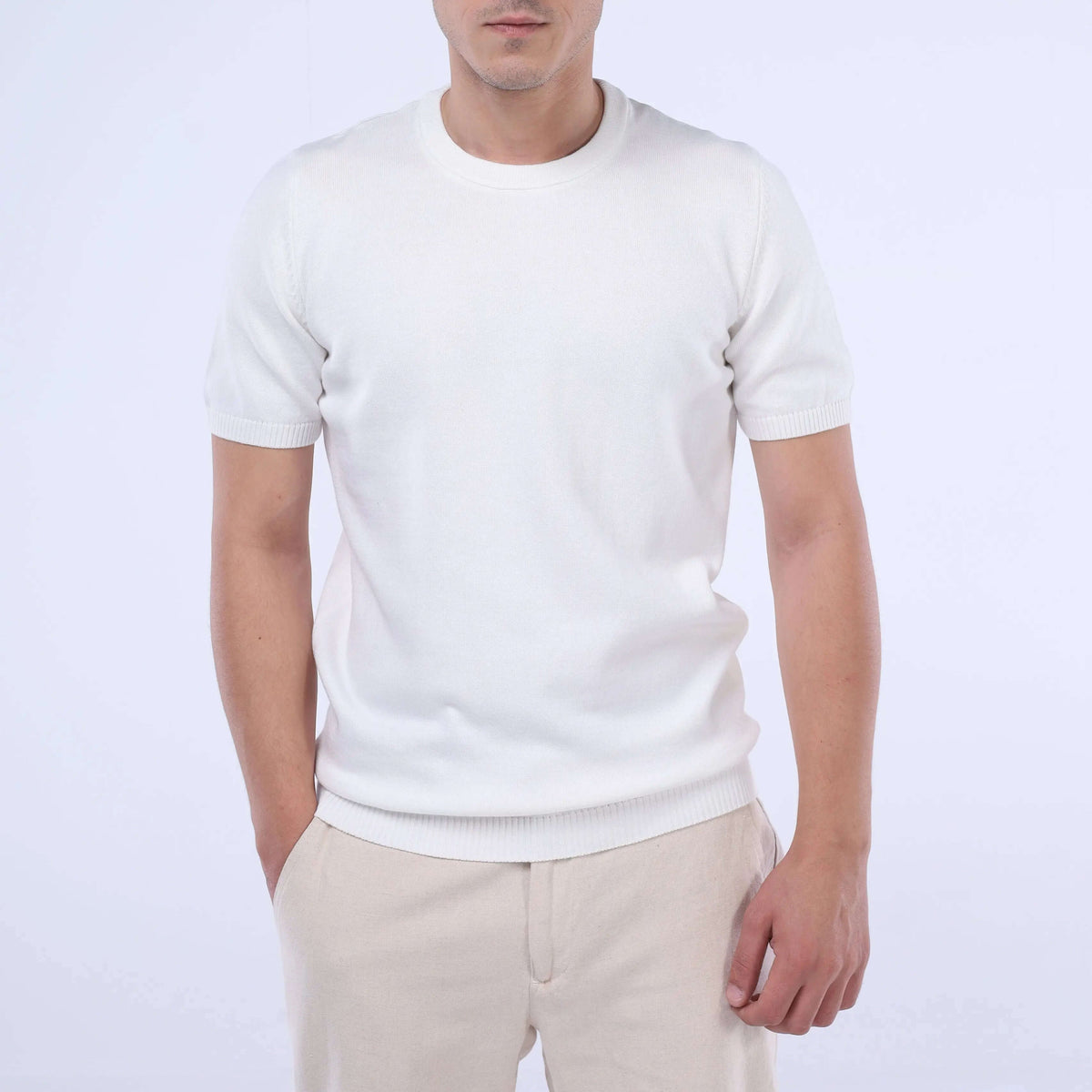 Model wearing the CloudKnit Crew Tee in white, showcasing its ultra-soft Egyptian cotton fabric.