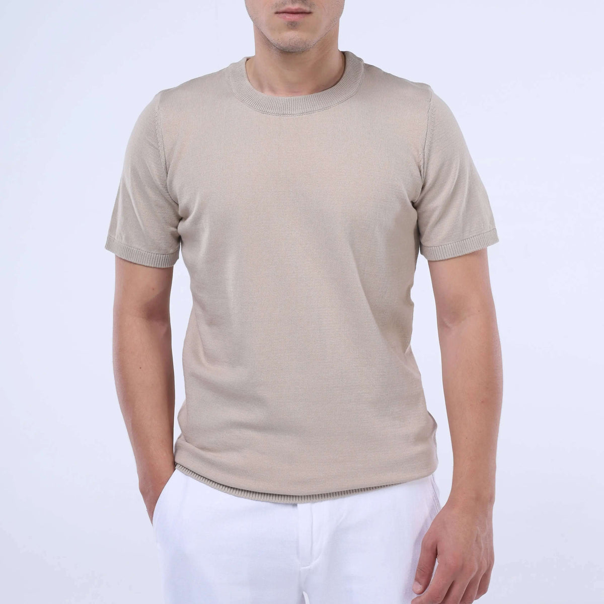 Model wearing CloudKnit Crew Tee in beige, showcasing premium cotton craftsmanship and breathable comfort.