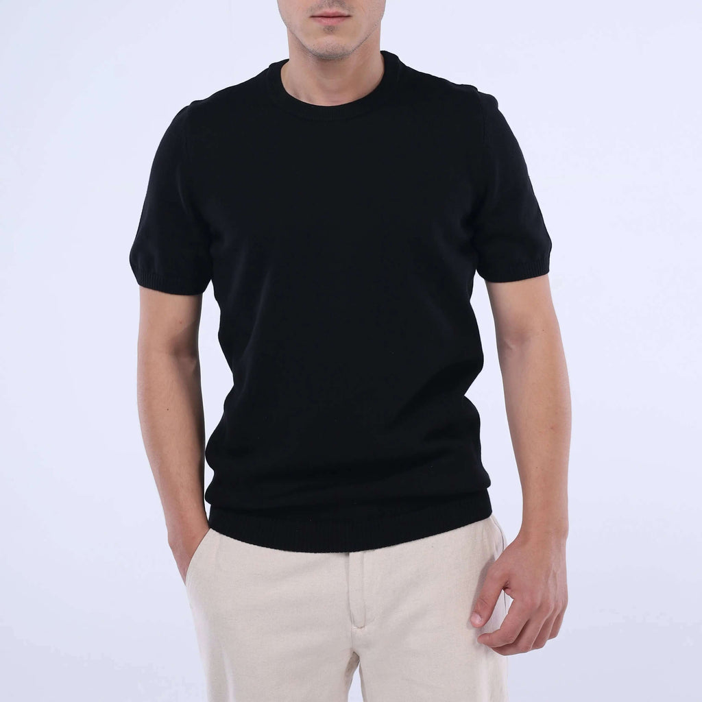 Model wearing a solid black CloudKnit Crew Tee, showcasing its ultra-soft premium cotton and modern fit.