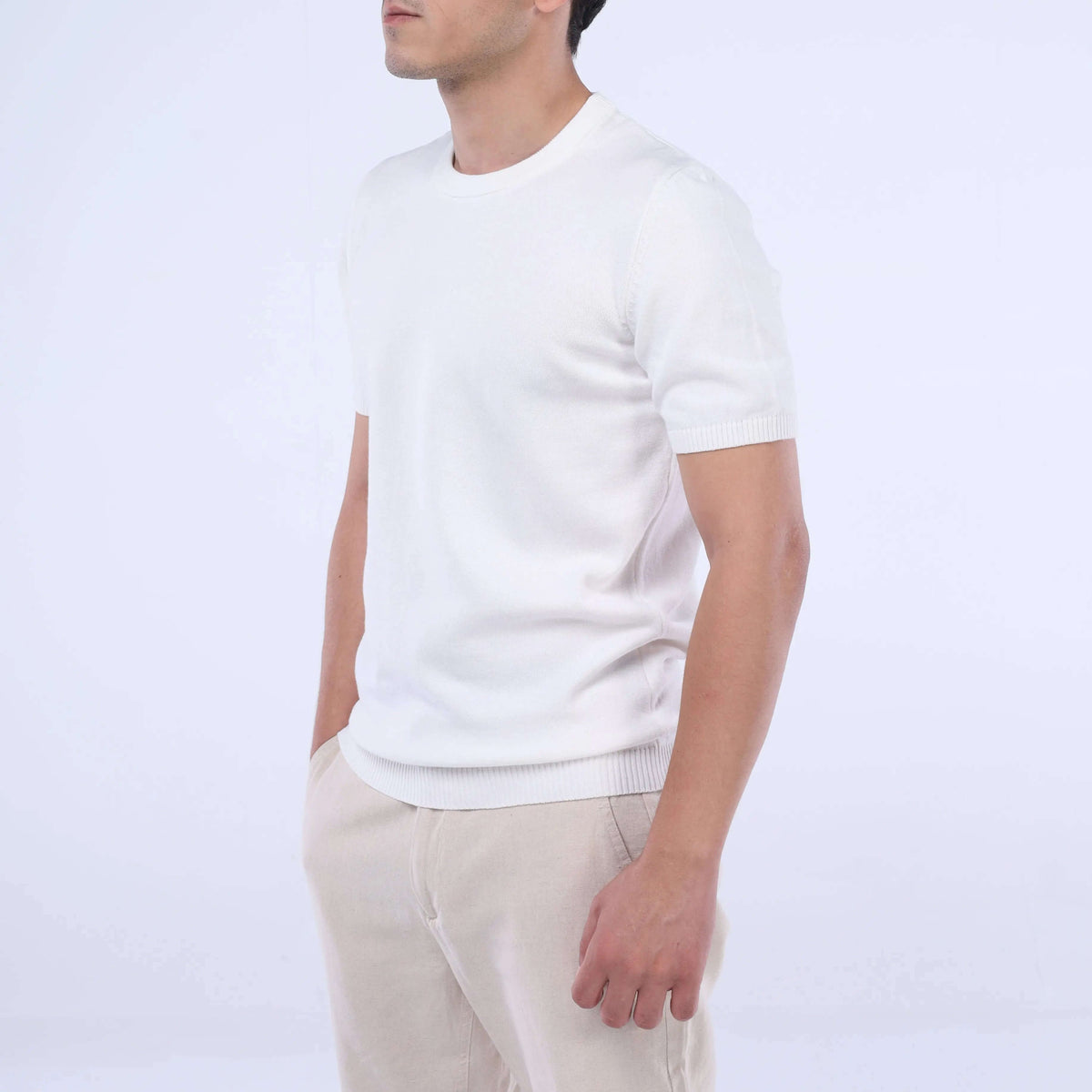 Model showcasing the CloudKnit Crew Tee in white, made from ultra-soft Egyptian cotton for ultimate comfort.