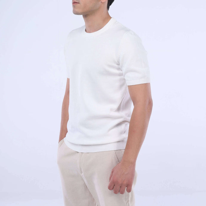 Model showcasing the CloudKnit Crew Tee in white, made from ultra-soft Egyptian cotton for ultimate comfort.