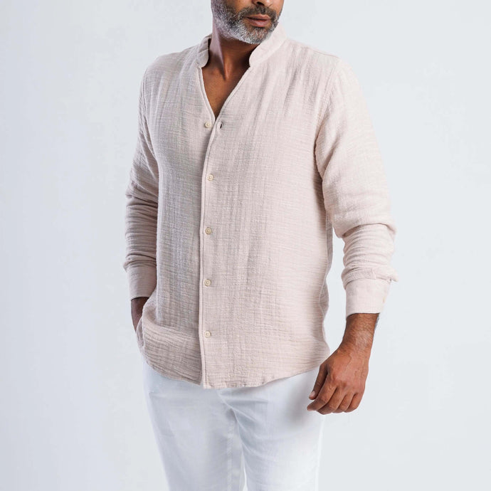 Collarless linen blend summer shirt in light beige worn by a man, showcasing modern, versatile style for warm weather.