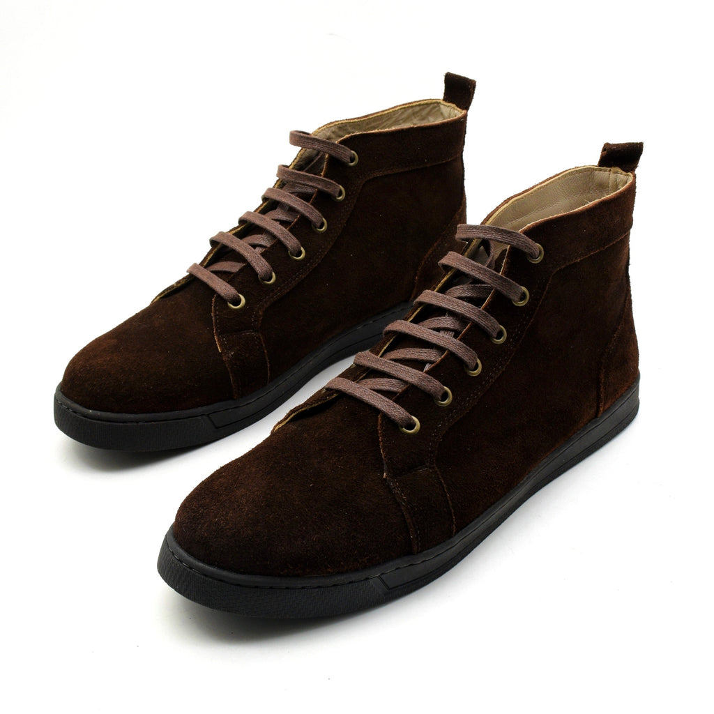 Pair of brown suede high-top shoes on a white background