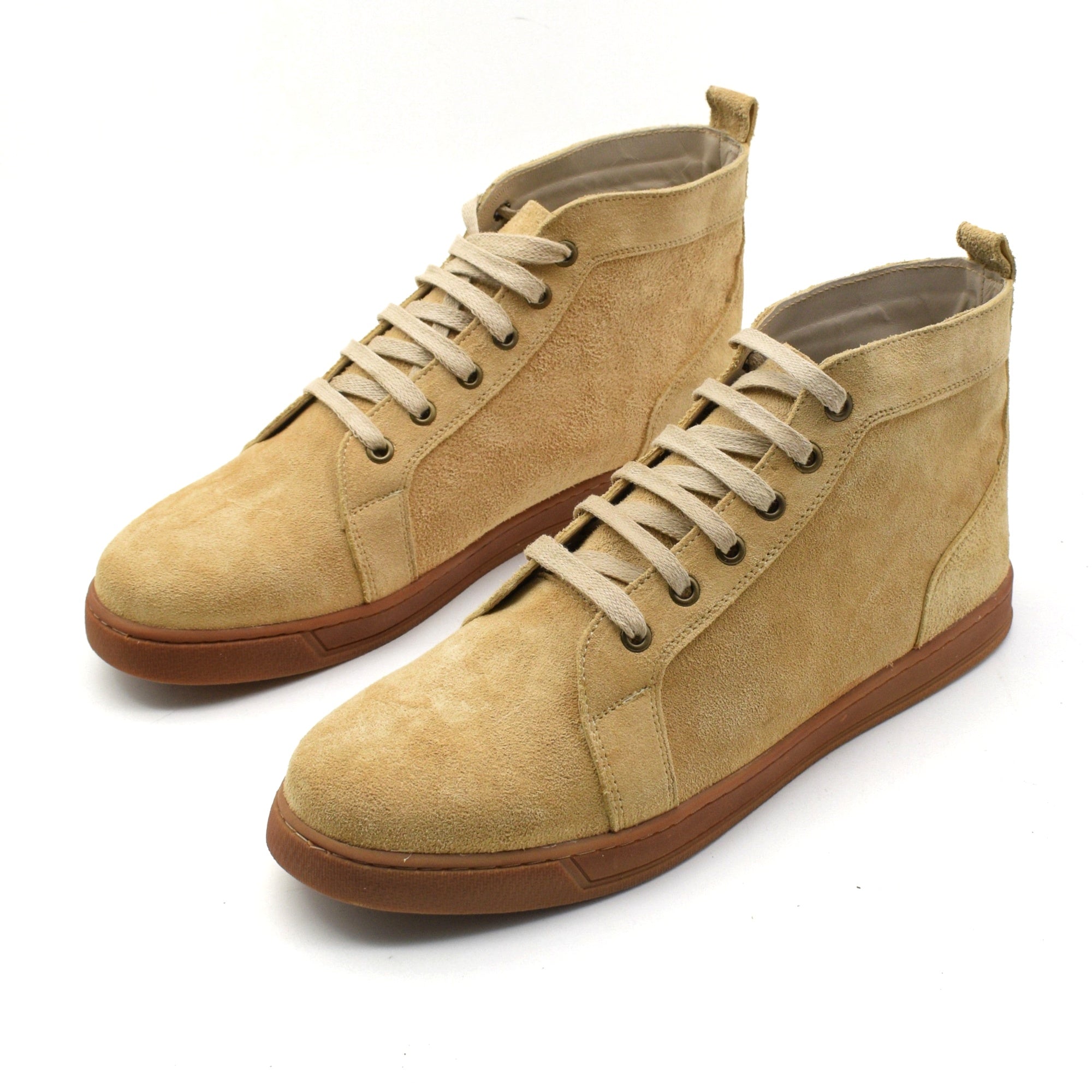 Pair of beige high-top sneakers with gum soles on a white background