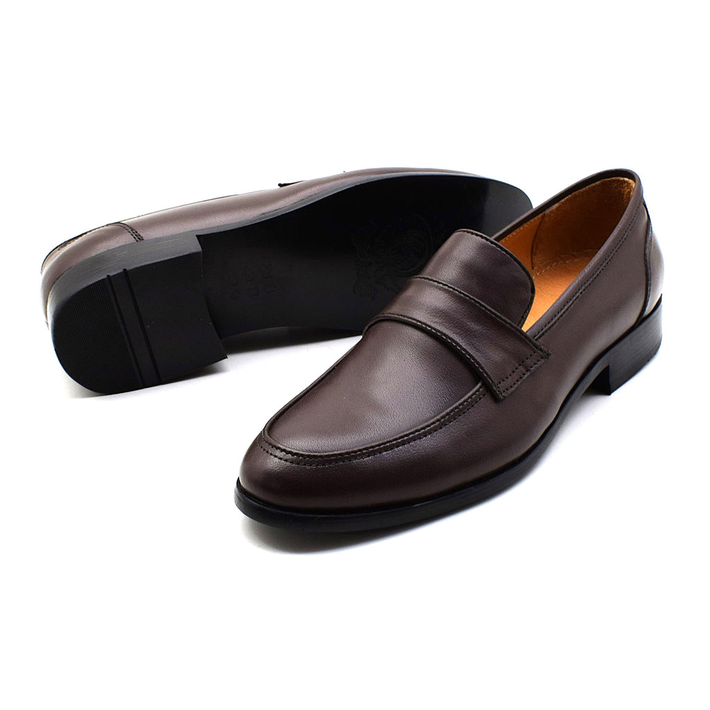 A pair of dark brown leather penny loafers, with one shoe showing the side profile and the other showing the sole, set against a plain white background.