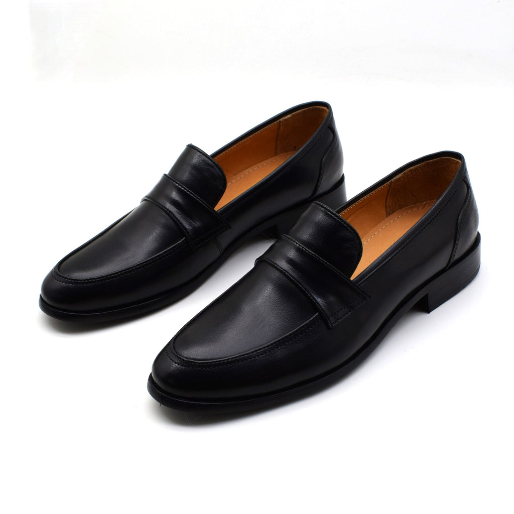 A pair of black leather penny loafers with a tan interior lining, displayed on a clean white background.