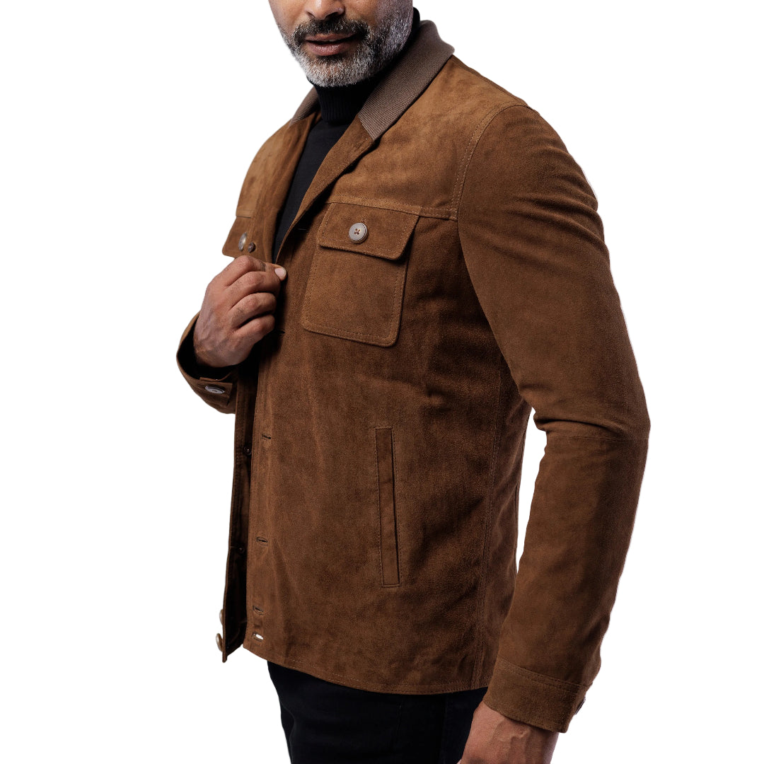 A man wearing a brown goat suede shawl collar cardigan with buttoned closure and two side pockets.