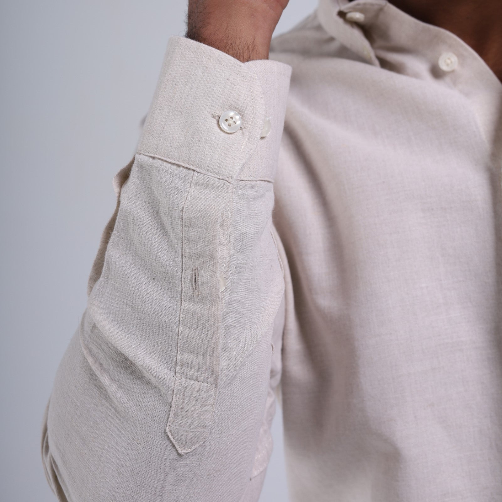 Close-up of beige pants with a blurred background