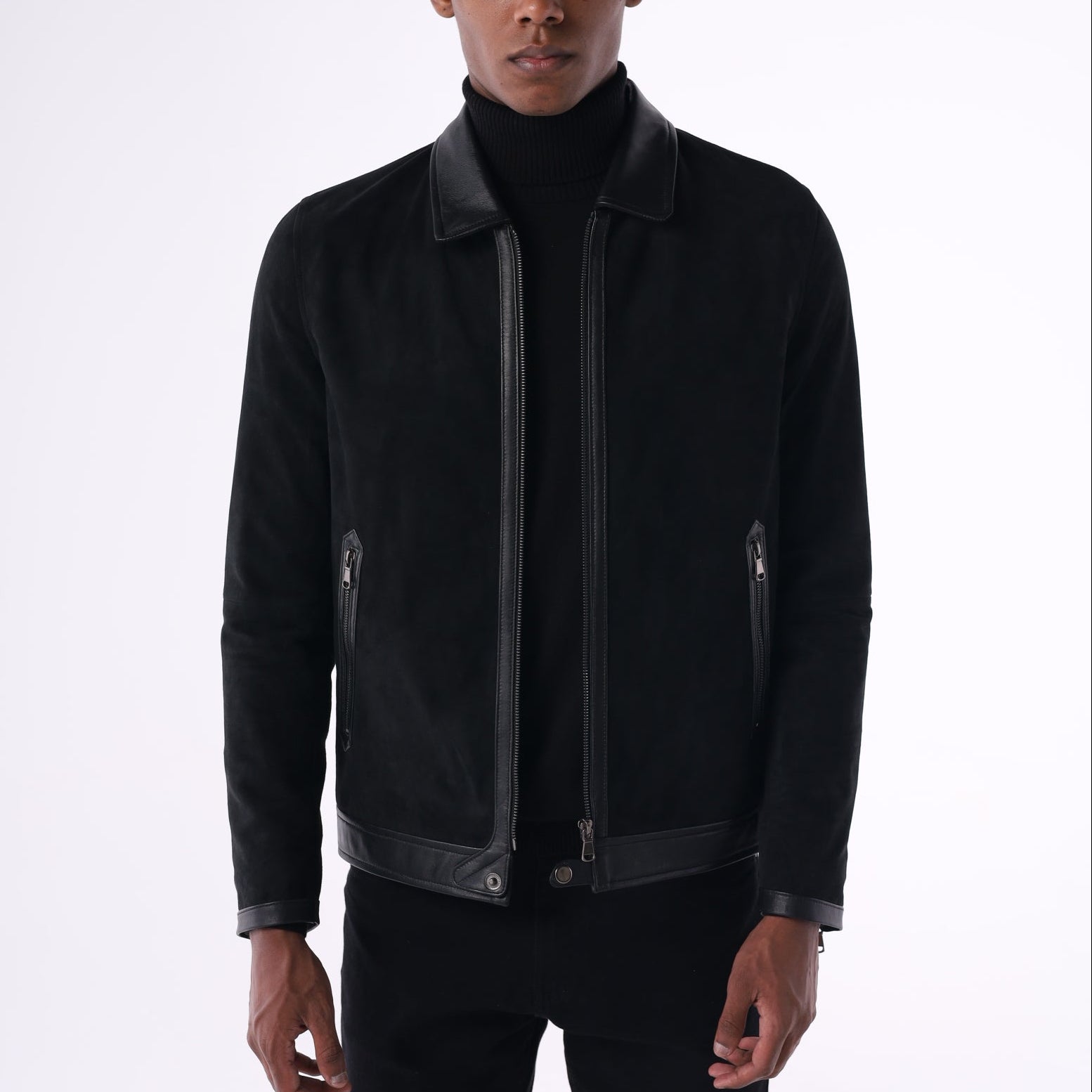 Person wearing a black jacket on a white background