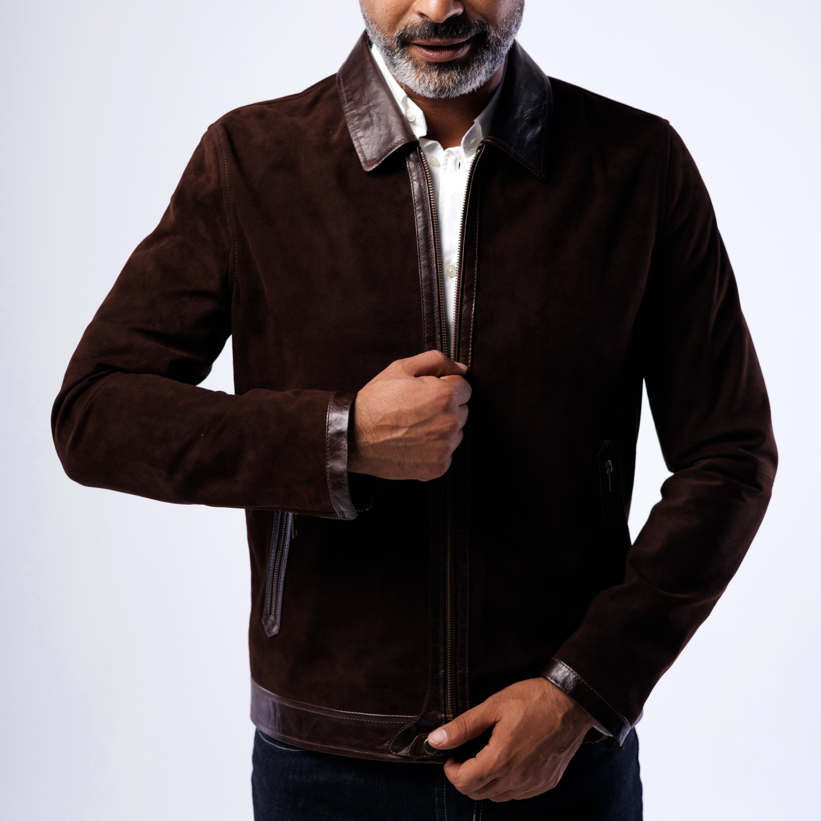 Man wearing a brown jacket with a white background