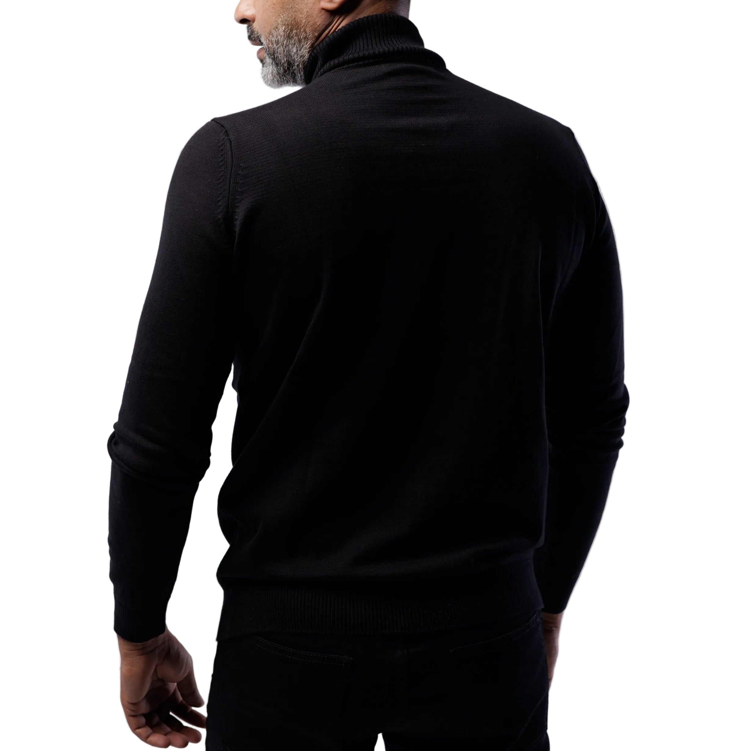 Man wearing a black turtleneck sweater against a light gray background