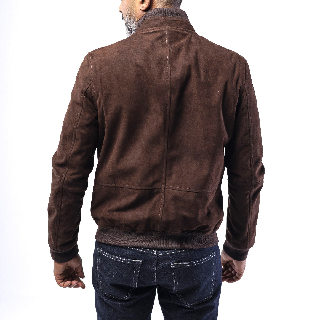 Man wearing a brown suede jacket on a white background