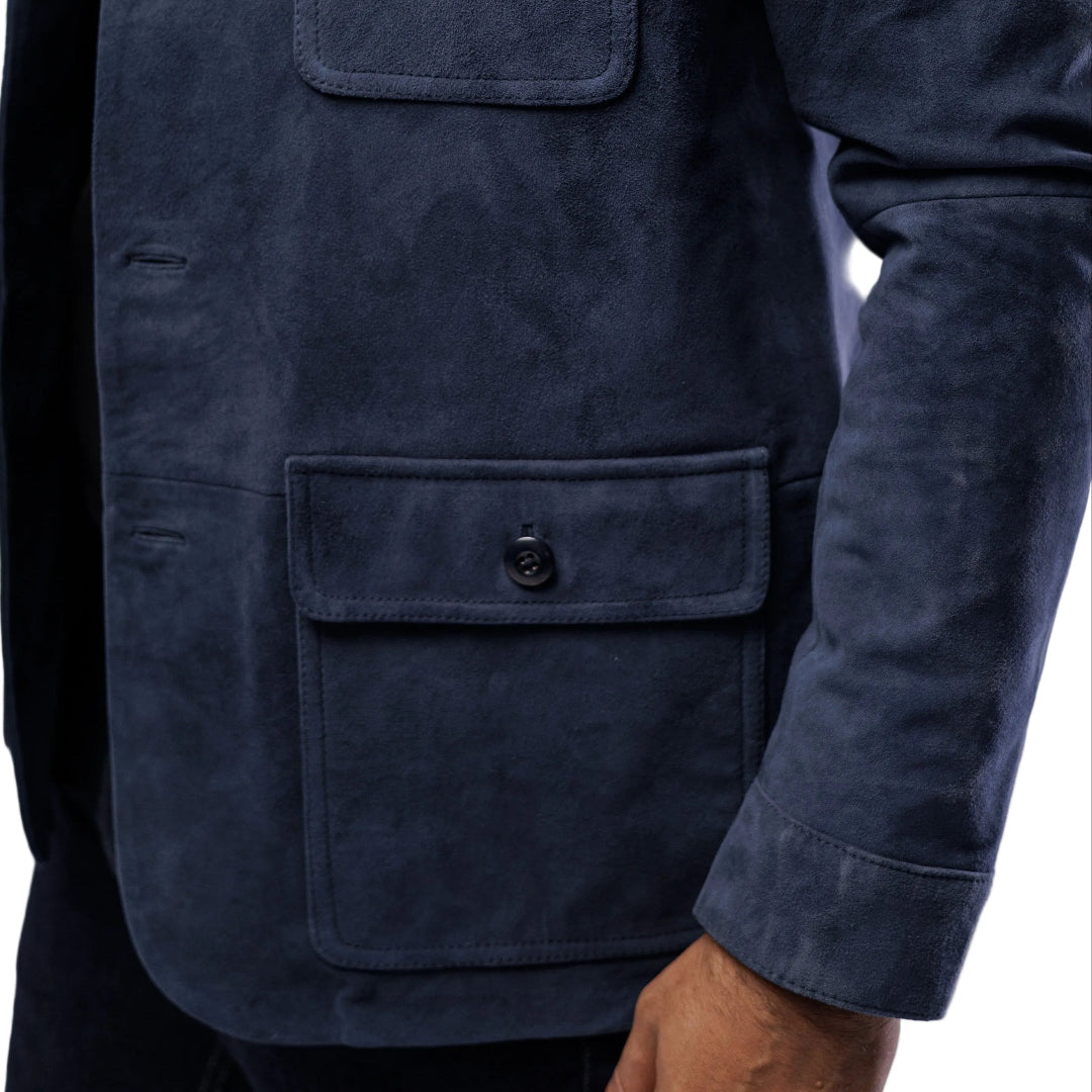 Navy blue jacket with two front pockets on a plain background
