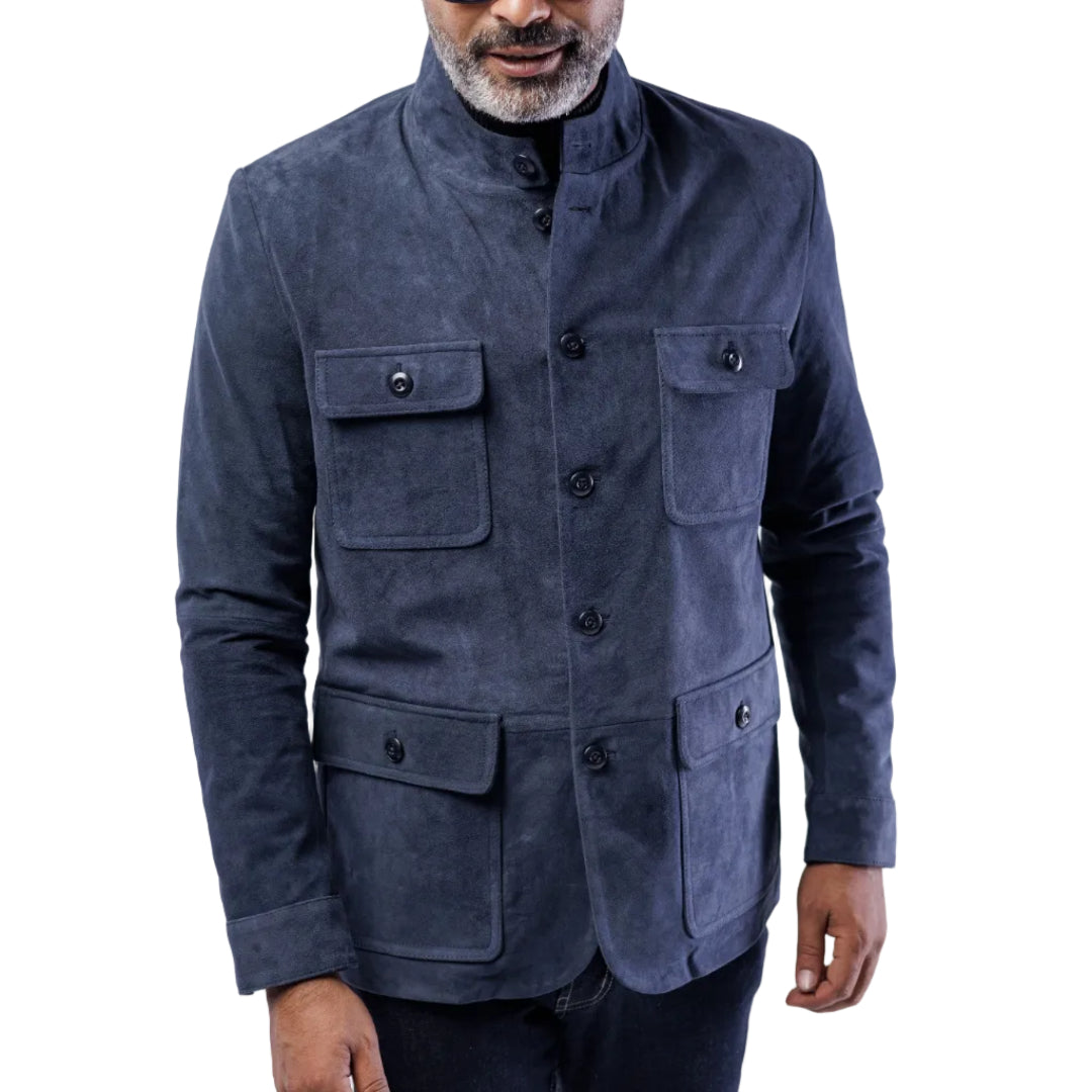 Man wearing a blue jacket with multiple pockets on a white background