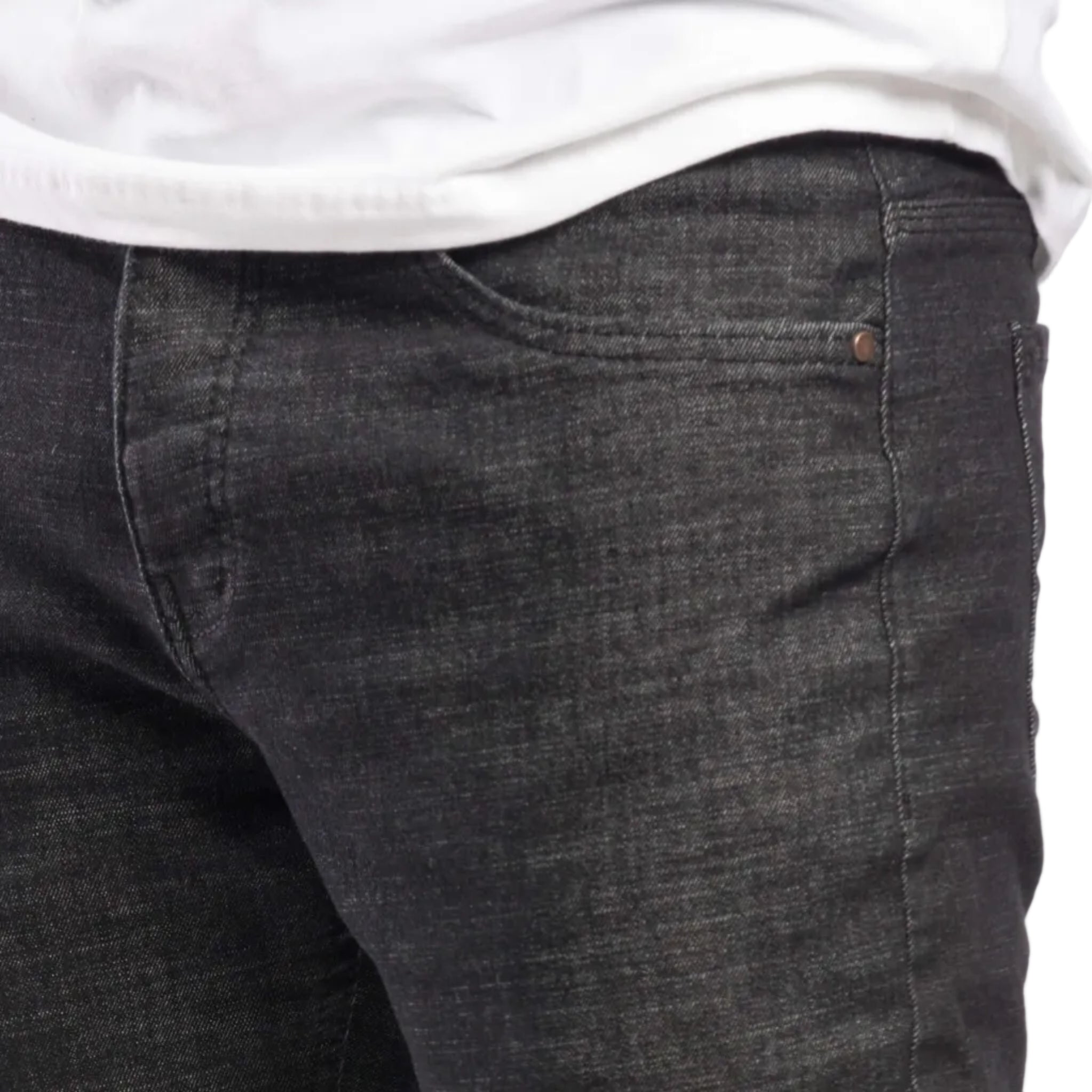 Dark gray jeans worn by a person on a white background