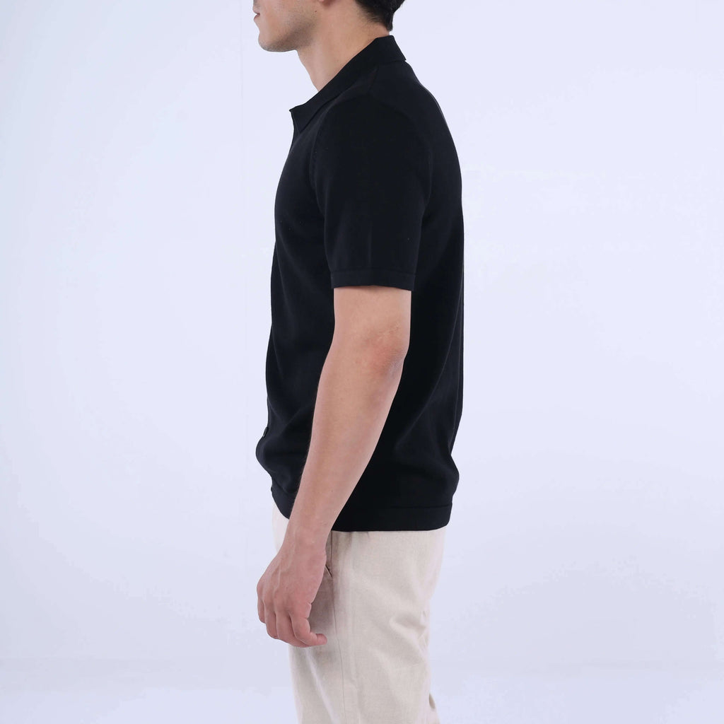 Model showcasing the Knit-Layer™ Short Sleeve Shirt in black, highlighting its slim fit and versatile style.