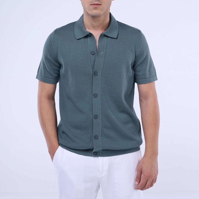 Men's Knit-Layer™ Short Sleeve Shirt in green, lightweight cotton, perfect for summer wear, styled with white trousers.