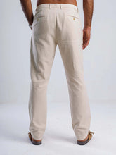 Load image into Gallery viewer, Men&#39;s linen blend tapered trousers showcasing a tailored fit and discreet back welt pockets.
