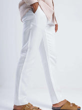 Load image into Gallery viewer, Linen blend tapered trousers in white, featuring a tailored fit and discreet side pockets.
