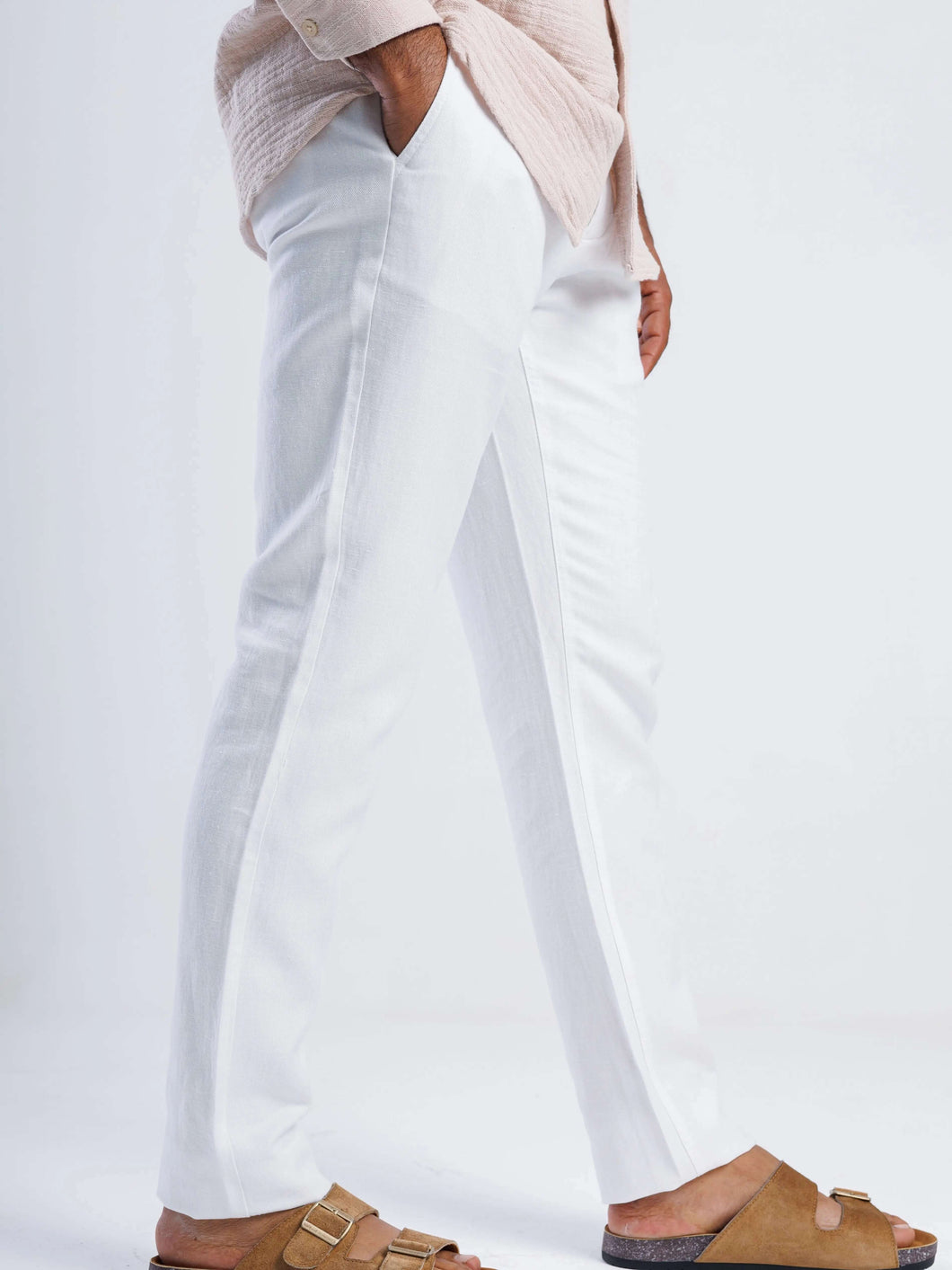 Linen blend tapered trousers in white, featuring a tailored fit and discreet side pockets.
