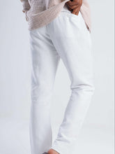 Load image into Gallery viewer, White linen blend tapered trousers showing side pockets and tailored fit, perfect for warm weather styling.
