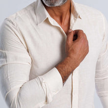 Load image into Gallery viewer, Linen blend slim-fit shirt in soft beige, featuring long sleeves and buttoned cuffs, perfect for summer elegance.
