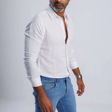 Load image into Gallery viewer, Linen blend slim-fit shirt in white worn with jeans, showcasing breathable comfort and elegant style.
