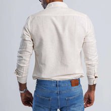 Load image into Gallery viewer, Back view of a man wearing a linen blend slim fit shirt, showcasing its soft and breathable fabric.

