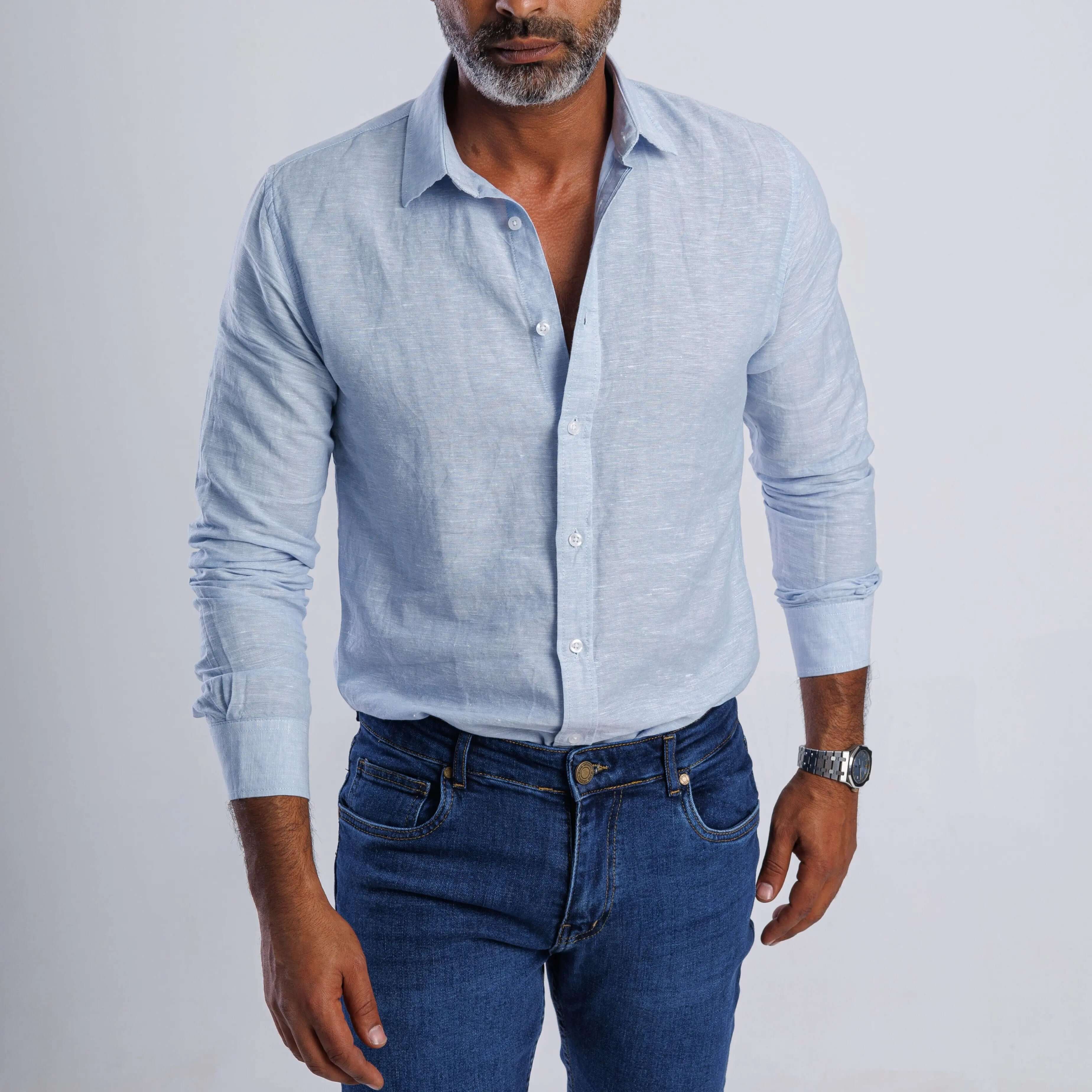 Linen blend slim-fit shirt in light blue worn with denim, showcasing breathable comfort and stylish elegance.