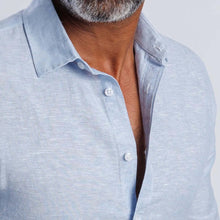Load image into Gallery viewer, Linen blend slim fit shirt in light blue with buttoned collar and cuff, showcasing softness and breathable comfort.
