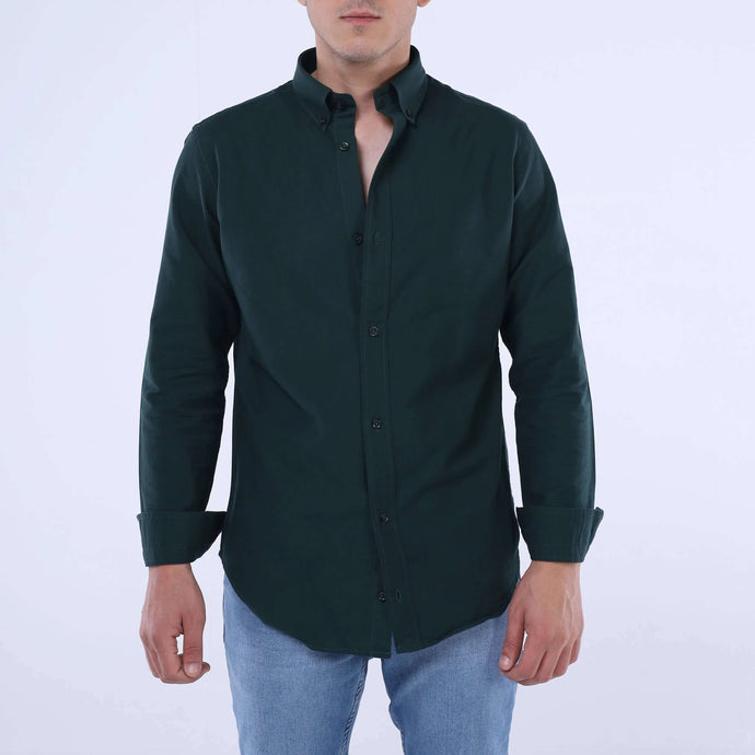 Model wearing a solid dark green Precision Oxford™ Shirt, showcasing its refined versatility and slim-fit design.