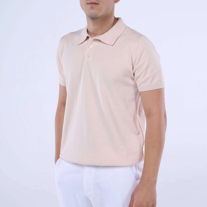 Model wearing SummerLite™ Peach Knit Polo, an ultra-lightweight cotton shirt in soft peach color, perfect for summer fashion.