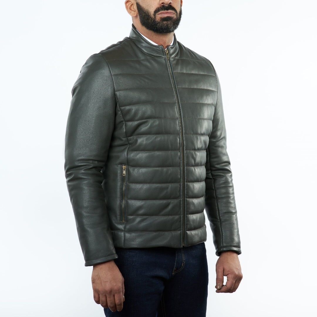 Man wearing a olive quilted leather jacket on a white background