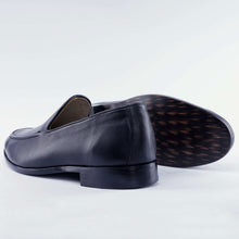 Load image into Gallery viewer, Pair of black leather loafers on a light gray background 3
