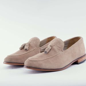 Luxe calf suede tassel loafers in olive green, showcasing handcrafted elegance for modern gentlemen.