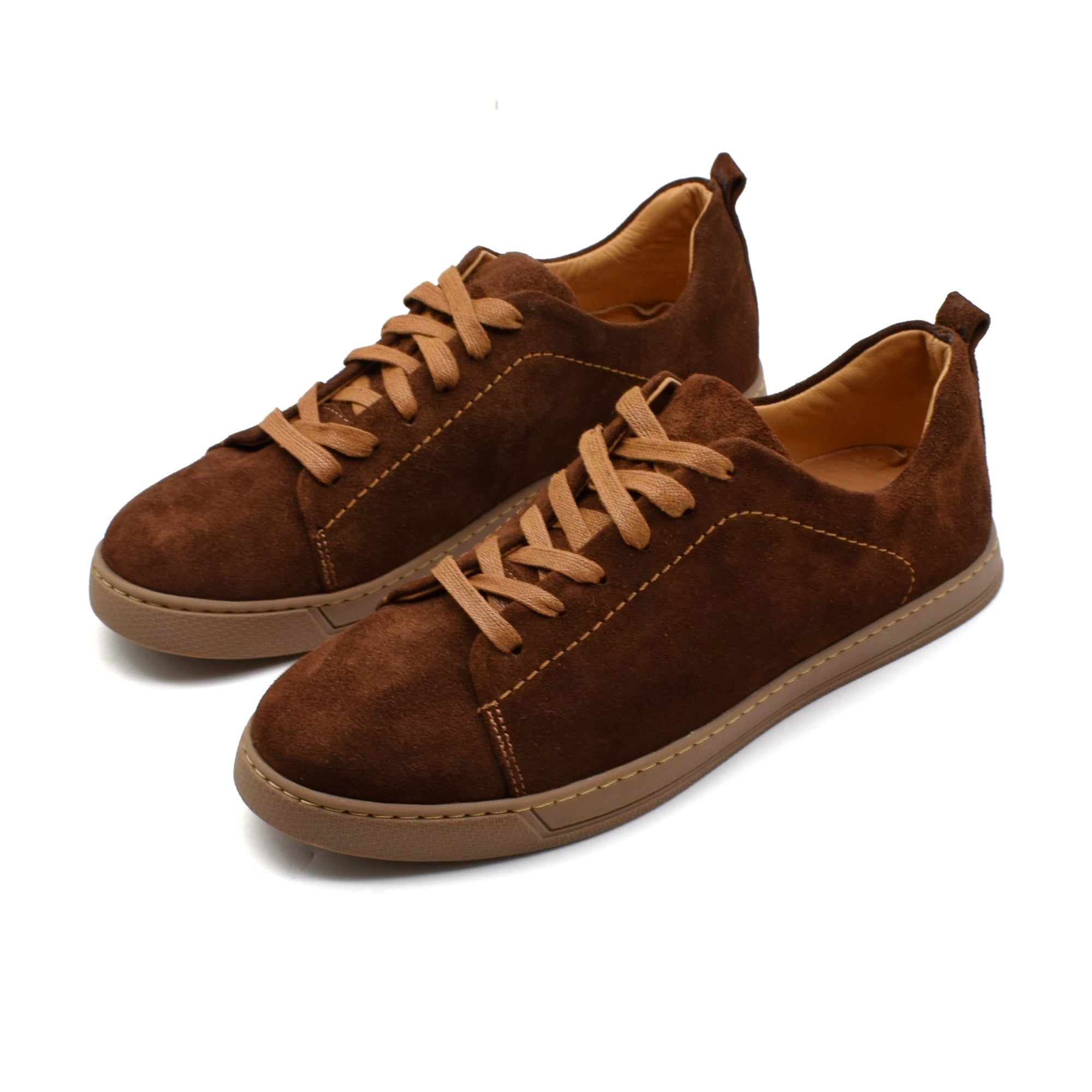 Pair of brown suede sneakers on a white background