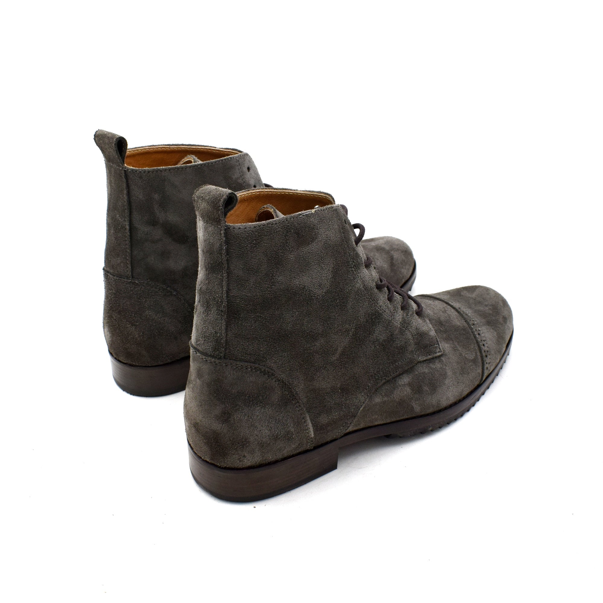 Pair of gray suede boots on a white background- back