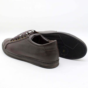 • Classic Low-Top Sneakers with a black rubber sole • Handcrafted in Egypt with premium full-grain calf leather upper • Features a sleek black sole for a bold, modern look • Genuine leather insole provides comfort by molding to your foot • Cushioned sole