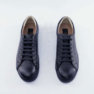 • Classic Low-Top Sneakers with a black rubber sole • Handcrafted in Egypt with premium full-grain calf leather upper • Features a sleek black sole for a bold, modern look • Genuine leather insole provides comfort by molding to your foot • Cushioned sole