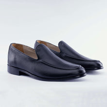 Load image into Gallery viewer, Pair of black leather loafers on a light gray background
