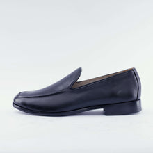 Load image into Gallery viewer, Pair of black leather loafers on a light gray background 2
